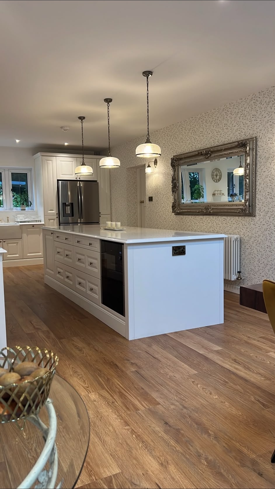 Kitchen island pendant lighting and wall lights installed by a domestic electrician in Fleet