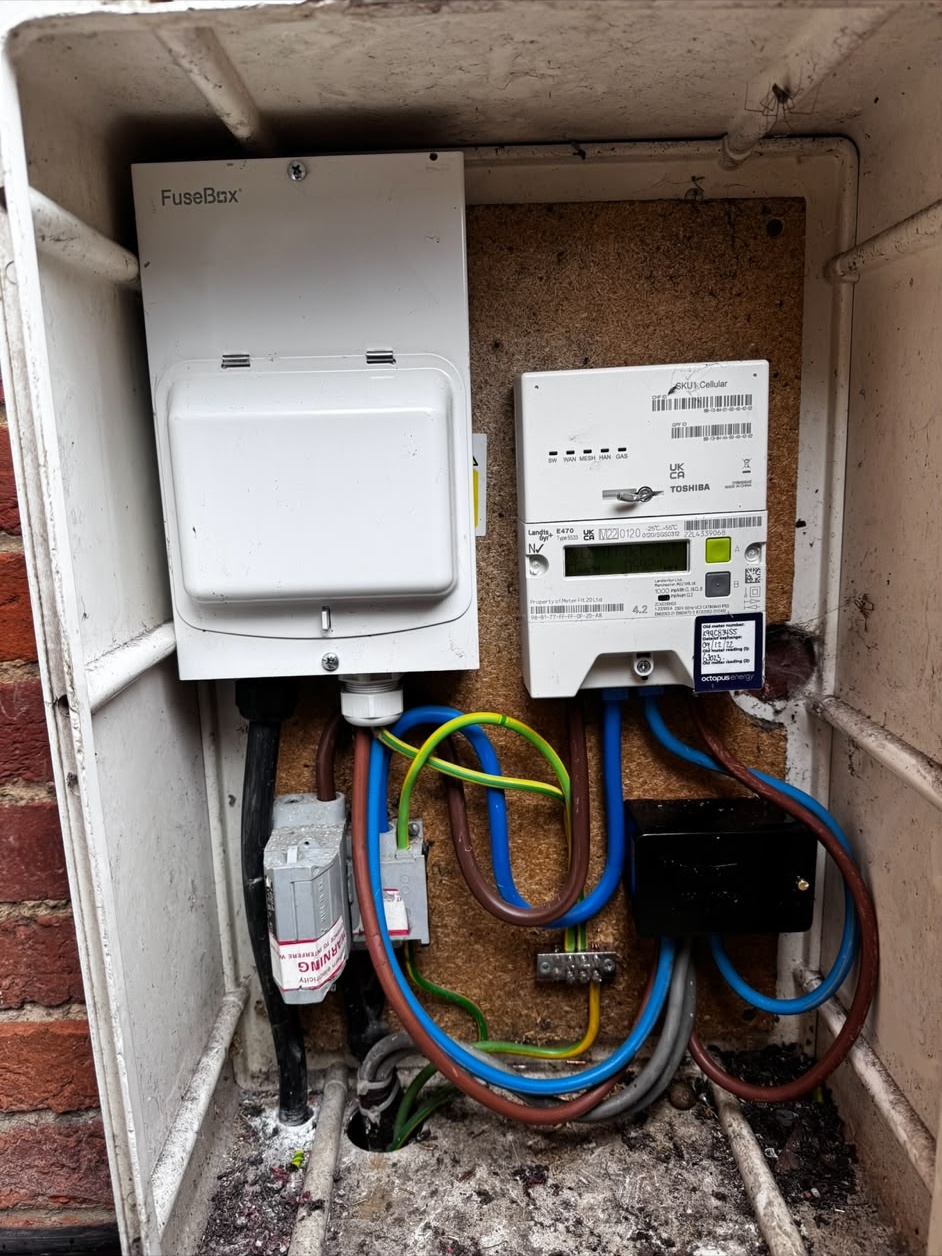 Upgraded consumer unit and electricity meter in an external meter box on a Hampshire home