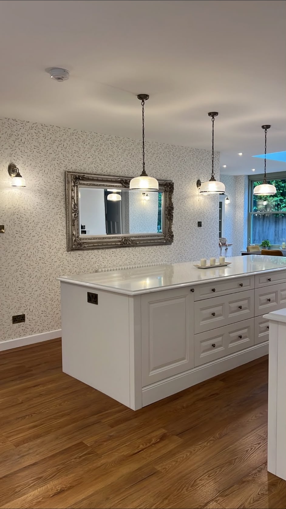 Kitchen lighting installation viewed from the island, wired by a NAPIT-registered electrician in Fleet